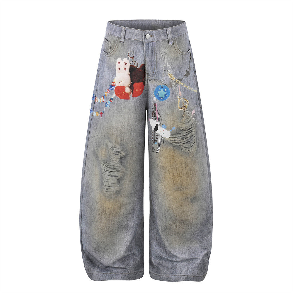 Oversized wide-leg distressed jeans in acid-washed grey denim with digital-print plush charm and bead details on the front pa