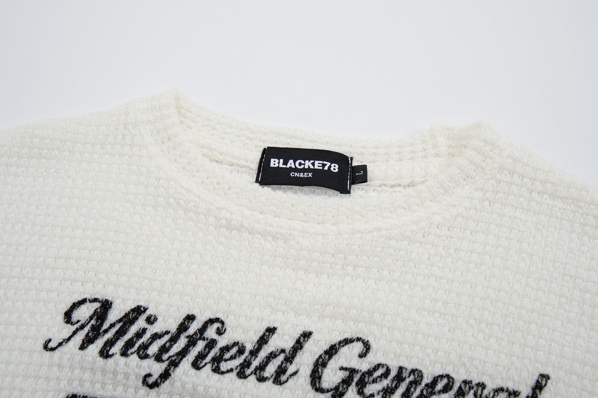 Midfield General 99 ワッフルニット長袖シャツ｜バーシティグラフィックトップス