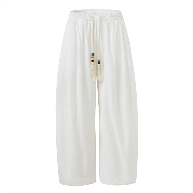 Men's baggy wide-leg pants in white with beaded drawstring and elastic waistband, relaxed street style fit