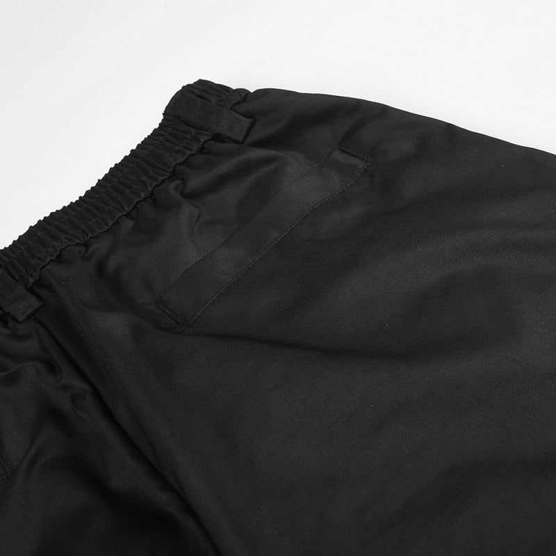 Wide-Leg Pleated Trousers – Oversized Silhouette with Curved Hem