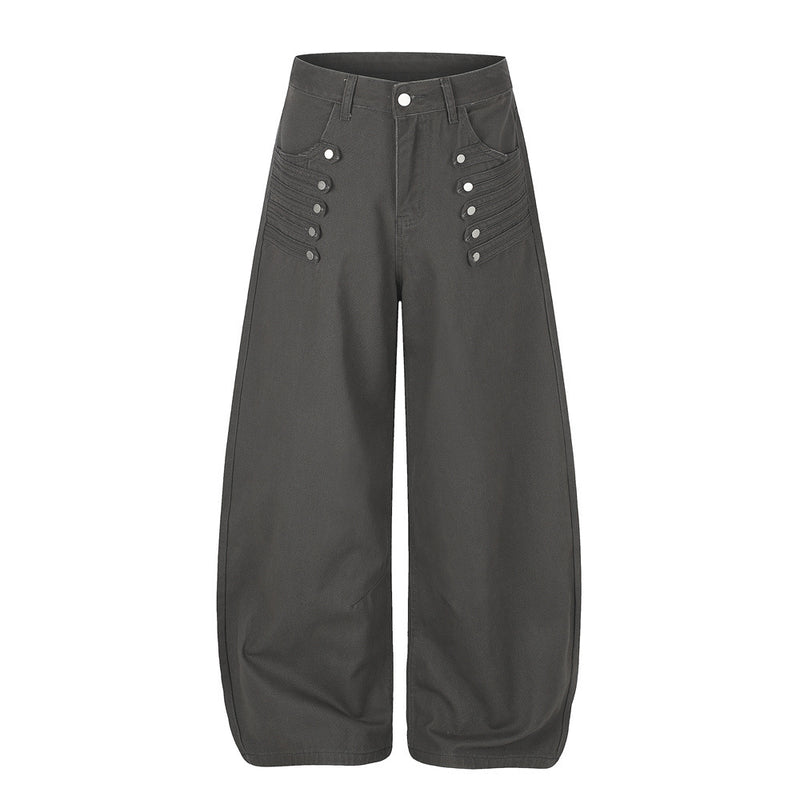 Men's wide-leg barrel pants with decorative metal snap buttons and pintuck detail in dark grey, front view