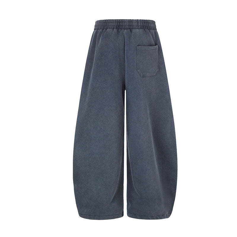 Pantalones de chándal de pierna ancha con cruz estampada y acabado lavado ácido