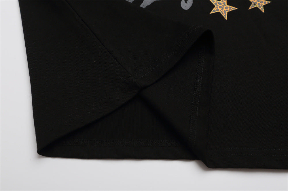 Black T-shirt side seam and lower hem close-up