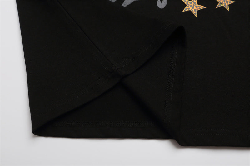Black T-shirt side seam and lower hem close-up