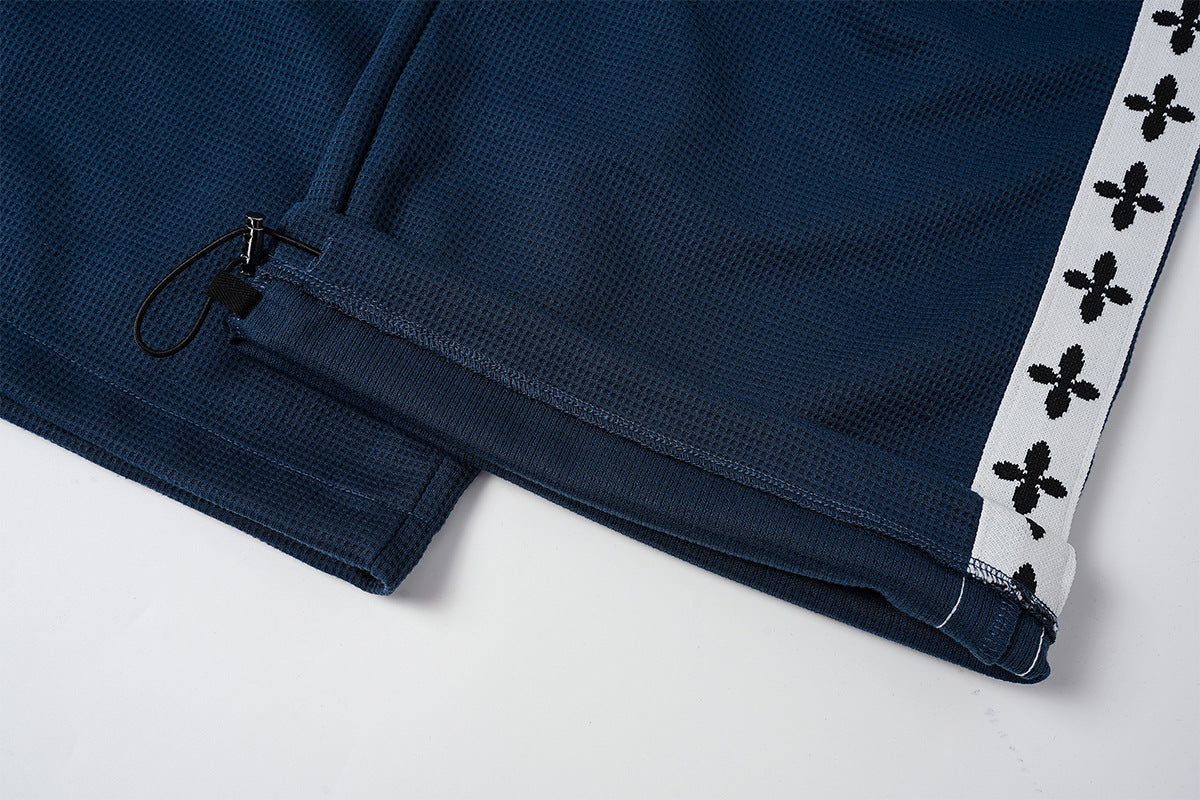 Pantalon de survêtement large à bandes latérales – Pantalon baggy en maille gaufrée