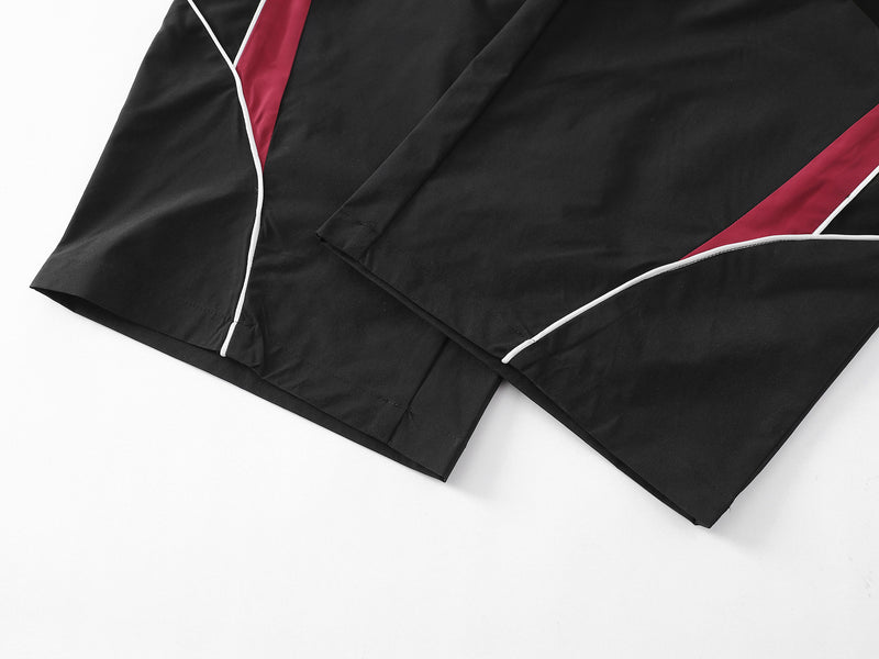 Herren-Trackpants mit kontrastierender Paspel und Colorblock-Seiteneinsätzen
