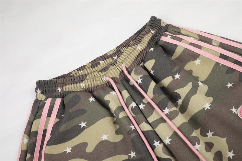 Close-up of elastic waistband and pink drawstrings on camo wide leg pants