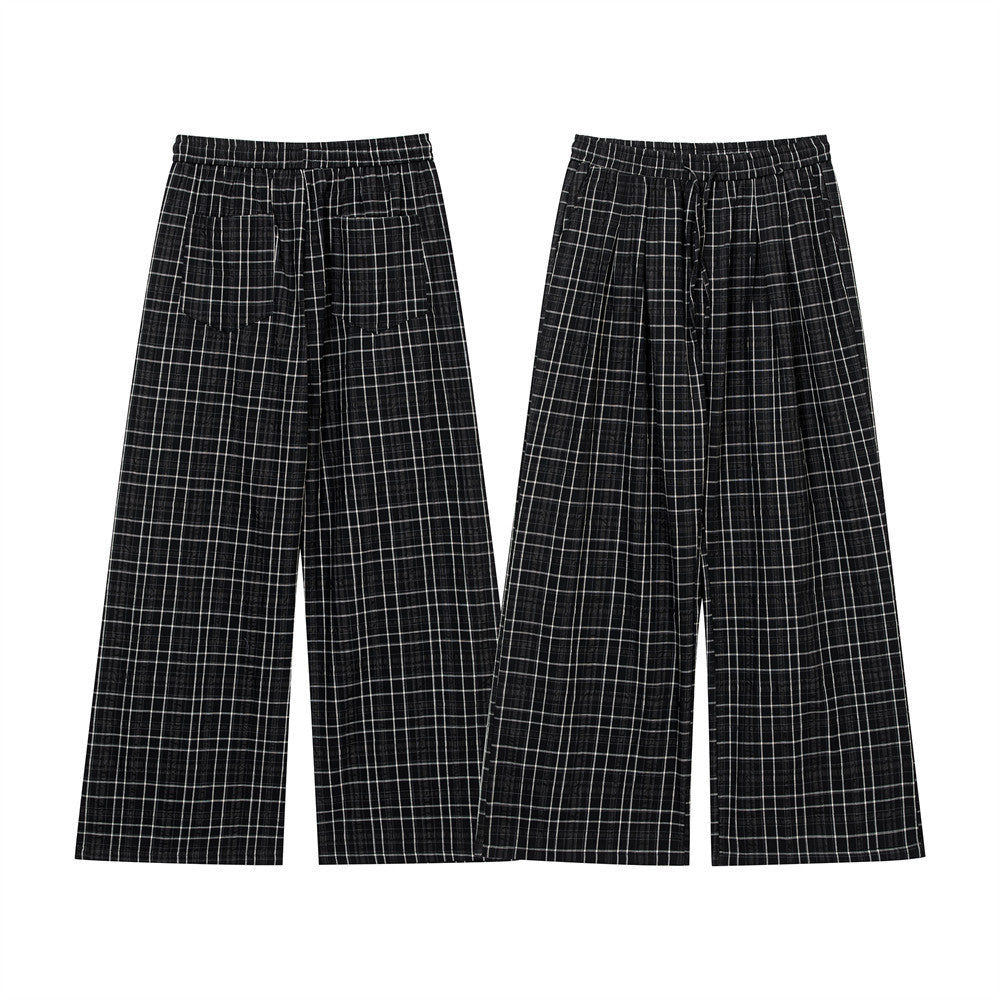Men's black and white plaid wide-leg drawstring trousers, front and back view