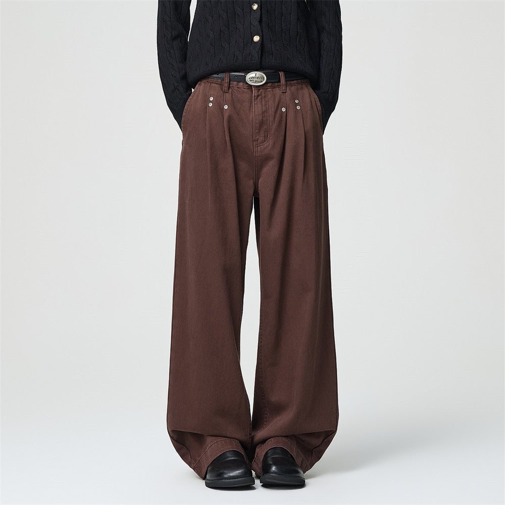 Men's wide-leg pleated trousers in brown with silver rivet waistband detail and straight-cut silhouette