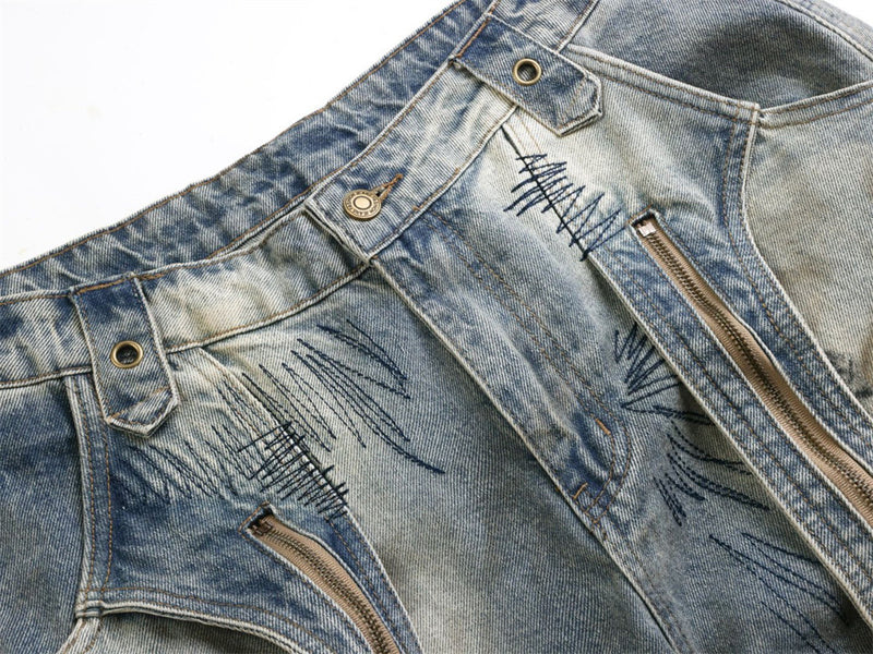 Baggy Wide-Leg Jeans – Chaotic Embroidery, Distressed Denim & Arc-Hem Design