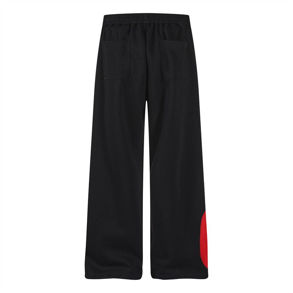 Wide-Leg Sweatpants with Camo & Script Patchwork Appliqués