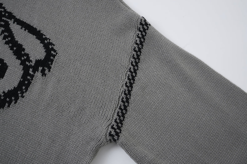Pull à capuche oversize en maille jacquard avec grand motif graphique sur le devant