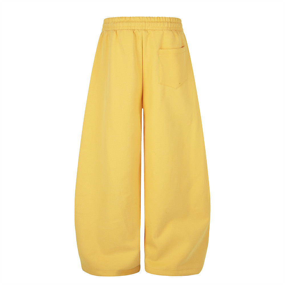 Yellow wide leg sweatpants, back view with patch pocket