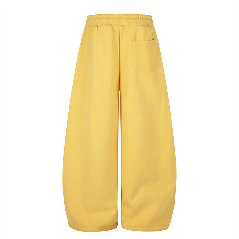 Yellow wide leg sweatpants, back view with patch pocket