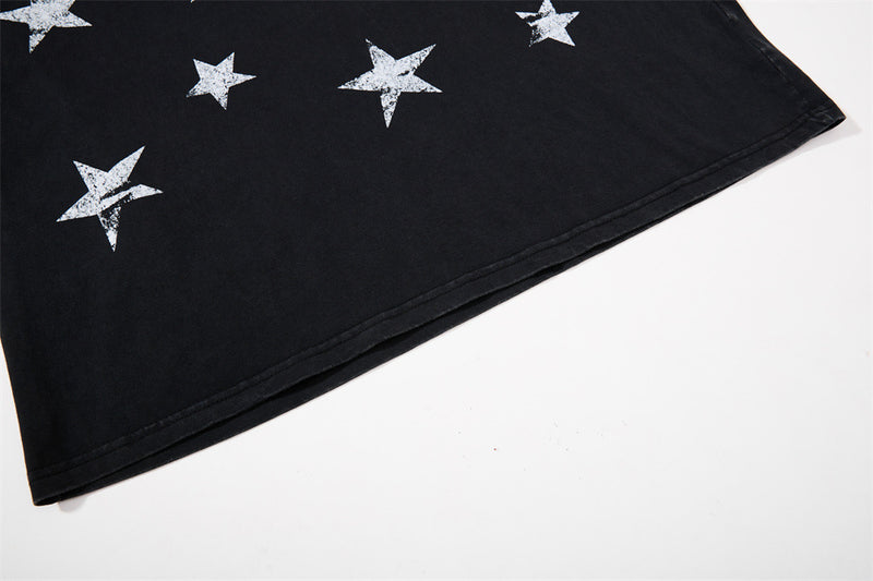 Close-up of black hem with white star print on raglan long sleeve tee
