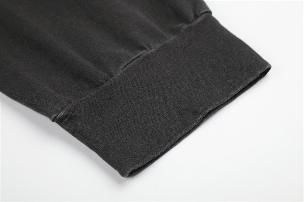 Close-up of black ribbed sleeve cuff on long sleeve shirt