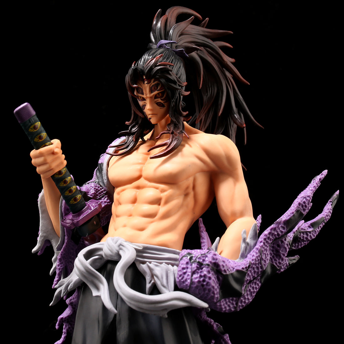 The Kokushibo Demon Slayer Figure is a 31CM PVC depiction of a muscular character with long dark hair and tribal face markings, featuring dragon scale gloves, a sheathed sword, and dressed in a robe with a tied belt—a must-have Kimetsu no Yaiba collectible by Demon Slayer.