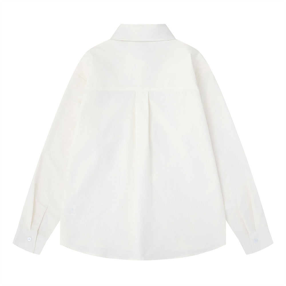 White oversized long sleeve button-down shirt back view with pleated yoke and curved hem