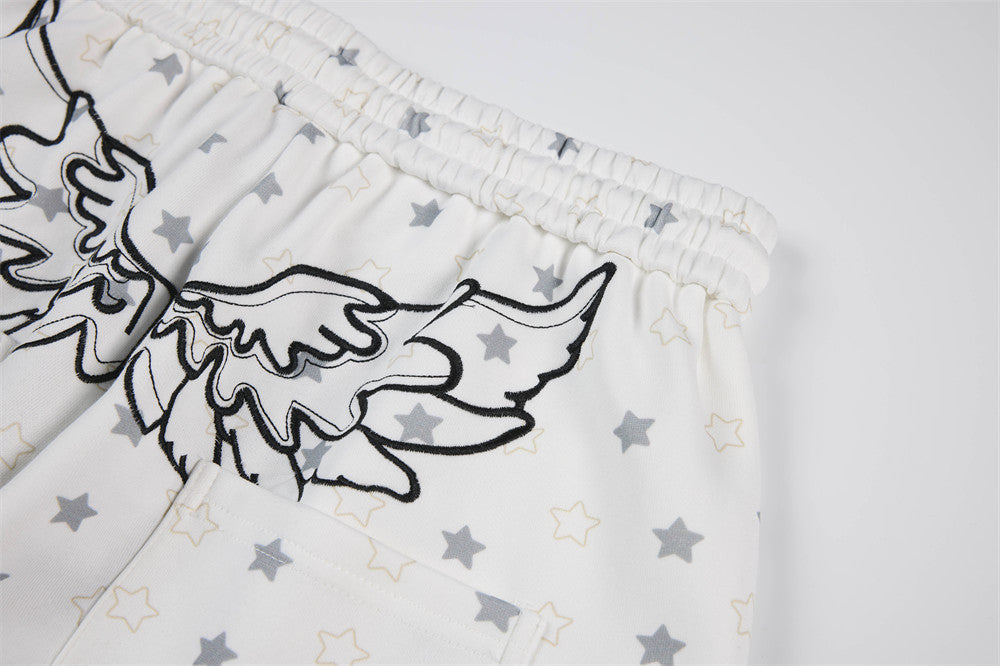 Pantalon de survêtement à jambes larges, imprimé étoiles, avec ailes d’ange et broderie de lettres