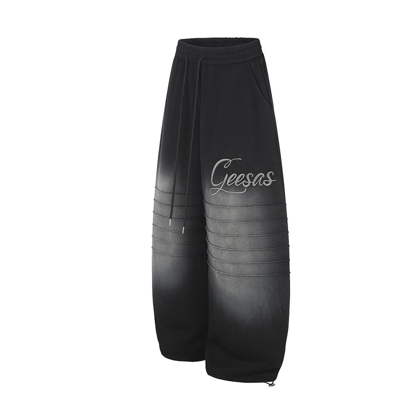 Pantalon de survêtement à jambes larges avec délavage dégradé et plis aux genoux