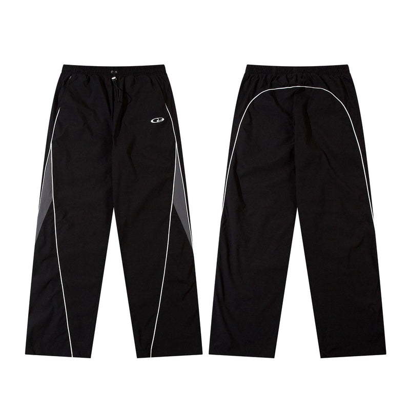 Herren-Trackpants mit kontrastierender Paspel und Colorblock-Seiteneinsätzen