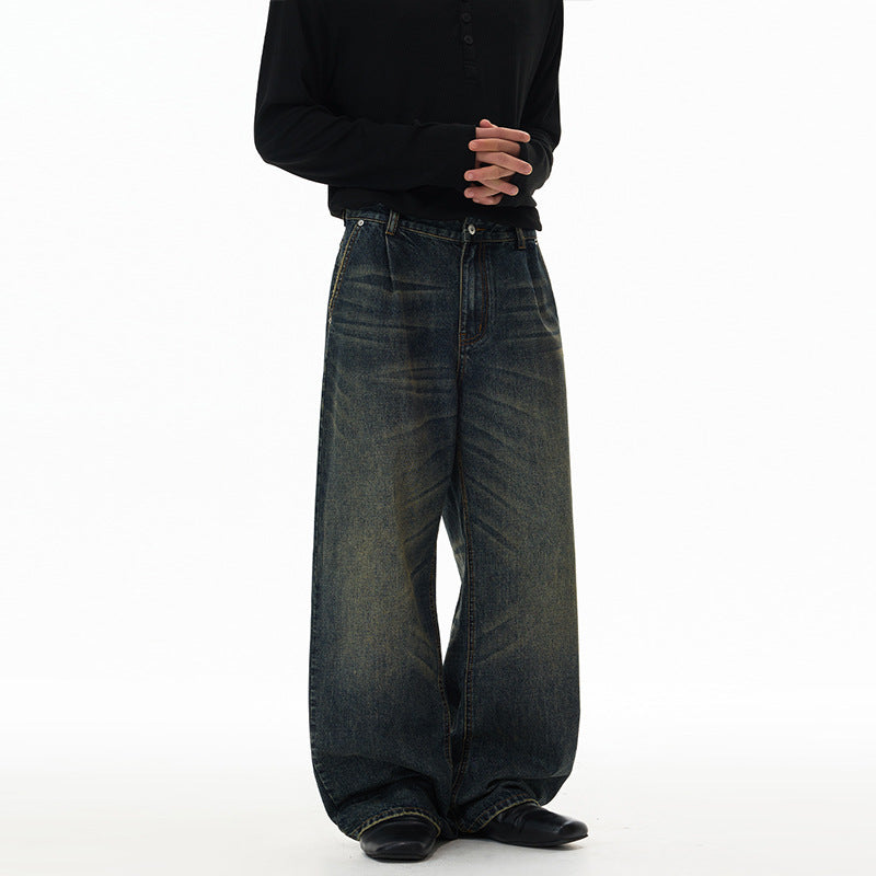 Jean homme vintage délavé bleu, coupe baggy droite et jambe large, avec délavage sable vieilli, vue en pied de face