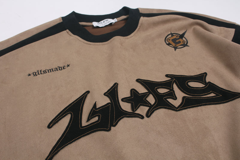 Langarmshirt aus velourslederartigem Material im Colorblock-Design mit Graffiti-Patch-Logo