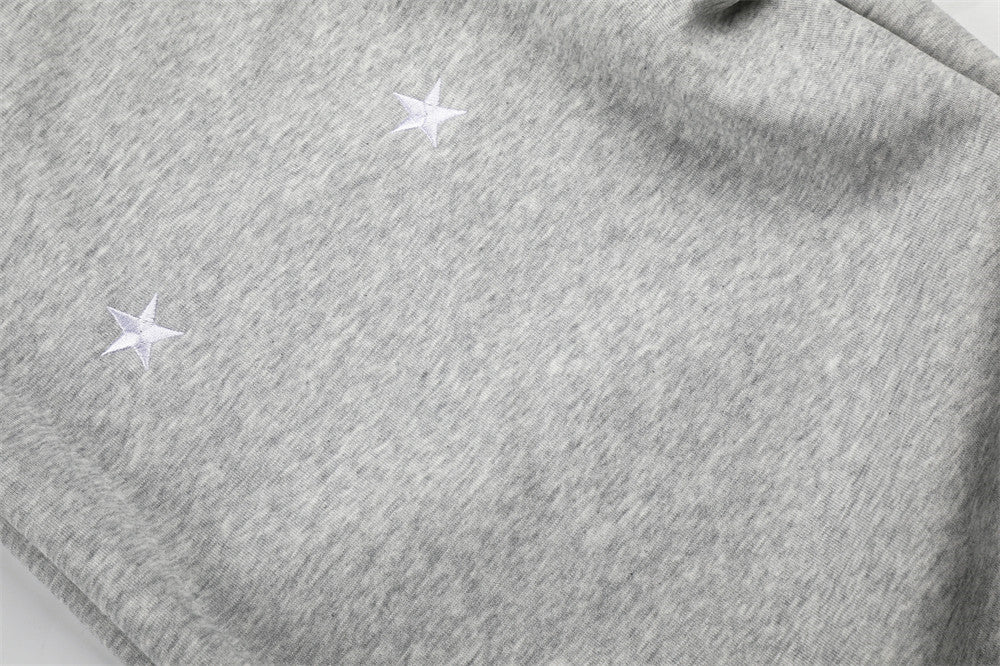 Sweatpants mit weitem Bein, Sternstickerei und umgeschlagenem Sherpa-Bund