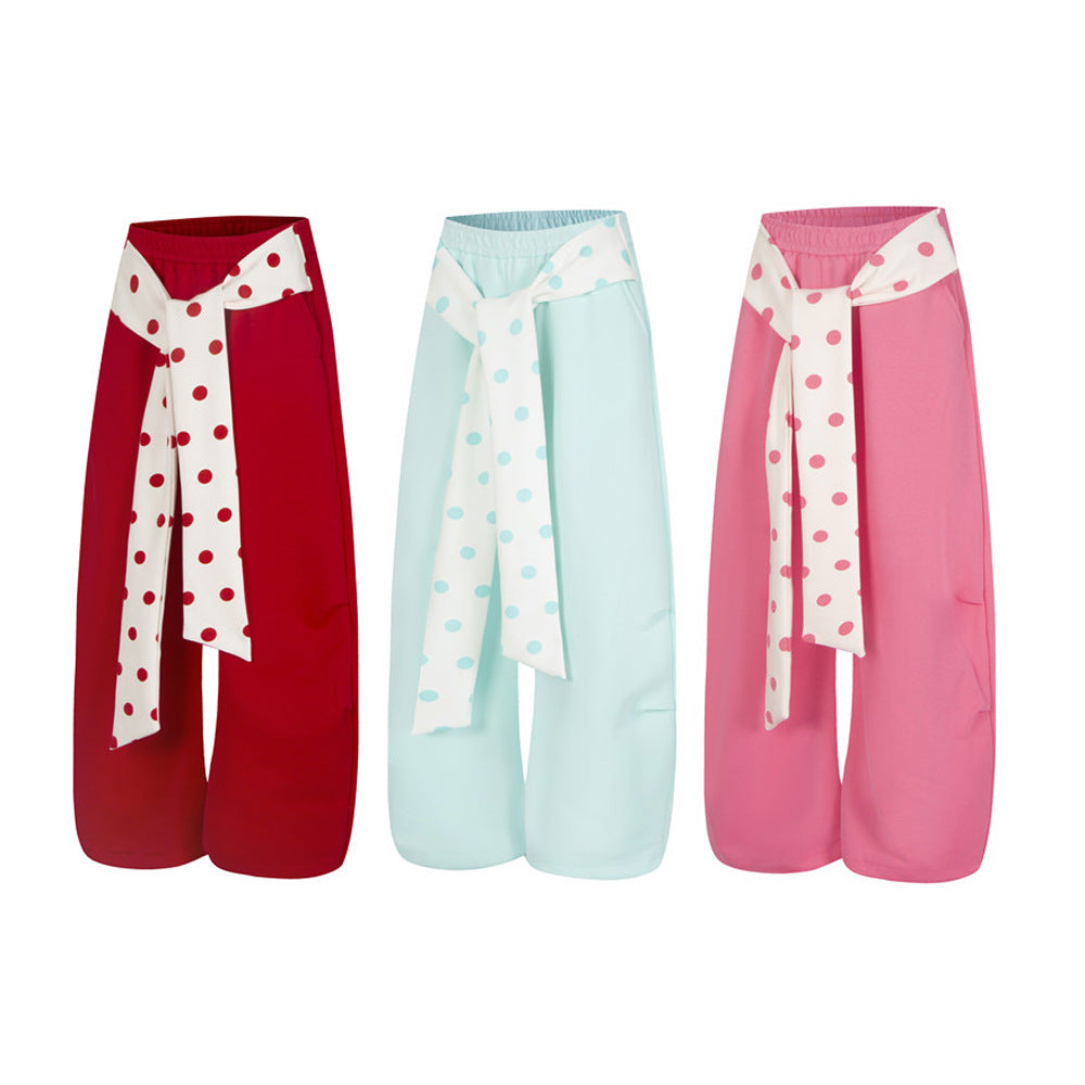 Unisex polka dot tie-waist wide leg sweatpants in red, mint blue, and pink colorblock styles
