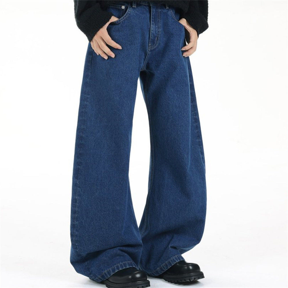 Men's dark blue baggy wide-leg jeans with curved silhouette and contrast rear pocket stitching