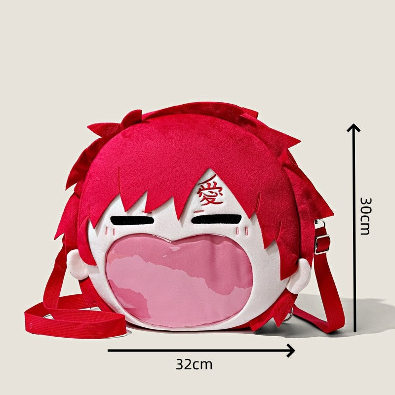 Explore the Seakoff Naruto Gaara Character Plush Shoulder Bag, featuring a unique 3D design in round red plush with closed eyes and pink accents. It includes a heart-shaped transparent mouth pocket, measures 32 cm by 30 cm, and has an adjustable red strap.