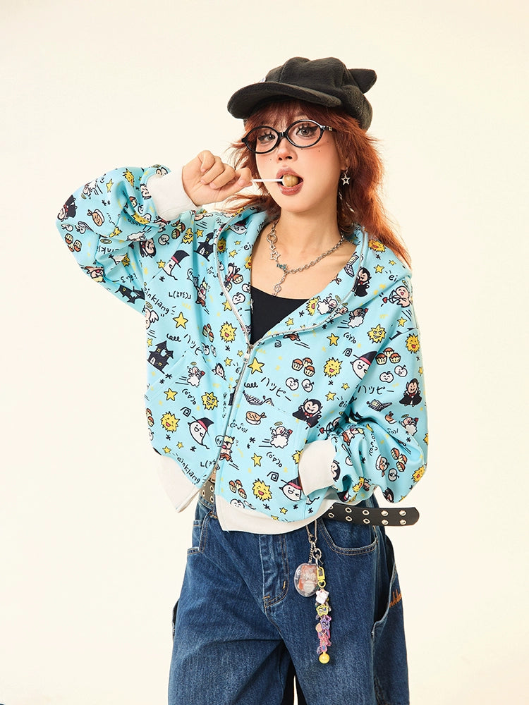 A person in a Seakoff Kawaii Cartoon Bear Hoodie, black top, and loose jeans poses with a hand near their mouth. They sport glasses, a black cap, and long red hair. A chain with accessories hangs from the jeans against a plain white background.