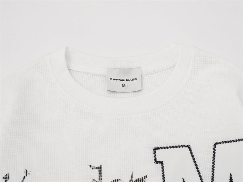 Herren-Langarmshirt mit Grafik – Oversize-Streetwear-Shirt aus Waffelstrick mit Schriftprint