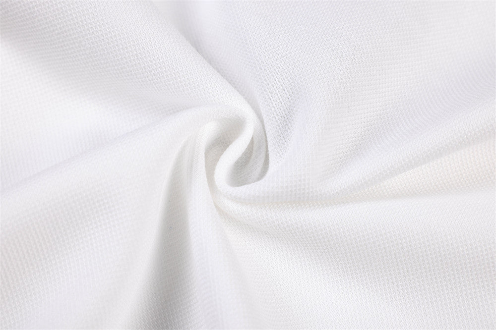 Close-up of white jersey fabric texture and fold detail
