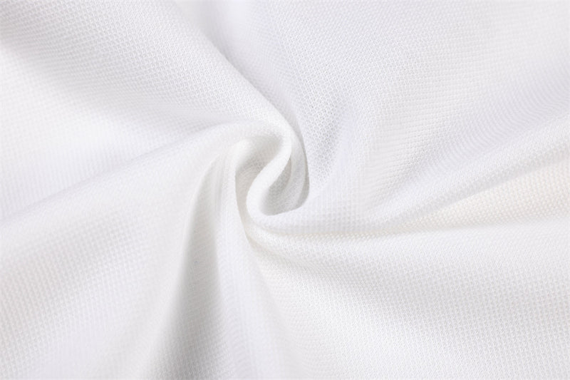 Close-up of white jersey fabric texture and fold detail