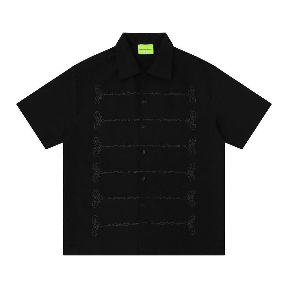Oversized chain embroidered short sleeve button-up shirt in black with tonal knot embroidery detail on front placket