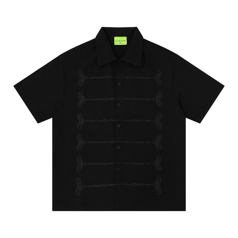 Oversized chain embroidered short sleeve button-up shirt in black with tonal knot embroidery detail on front placket