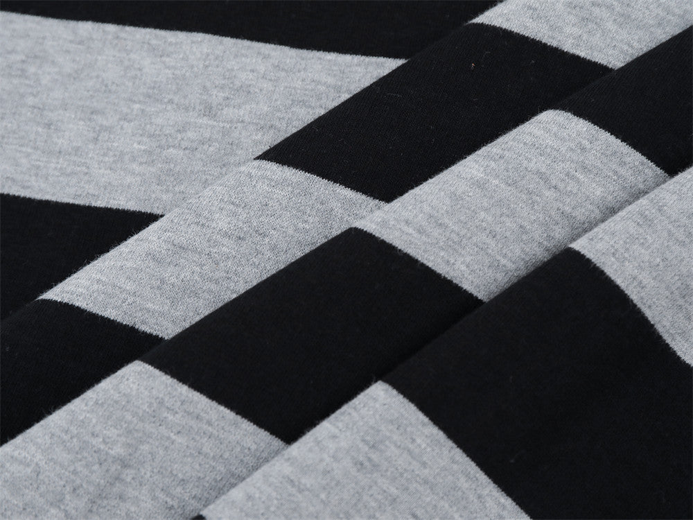 Close-up of black and gray striped fabric with crossed stripe pattern