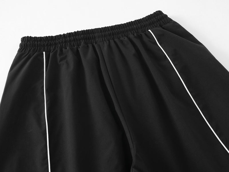 Herren-Trackpants mit kontrastierender Paspel und Colorblock-Seiteneinsätzen
