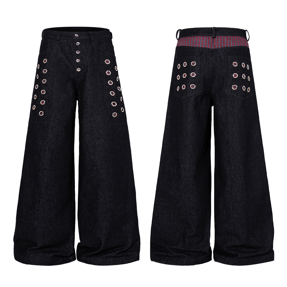 Black wide-leg denim jeans with silver metal eyelet grommet details on front thighs and button-fly closure, front and back vi