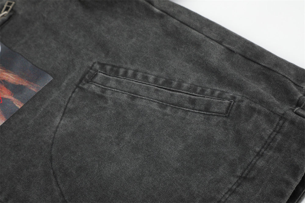 Close-up of black jacket back pocket detail with top welt opening