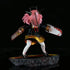 The 17.5 cm PVC figure, Chainsaw Man Anya Forger from Spy × Family, showcases a character in Chainsaw cosplay with pink hair and a horned helmet. Dressed in a black and gold outfit, they hold two blood-splattered chainsaws while standing on a textured rock base.