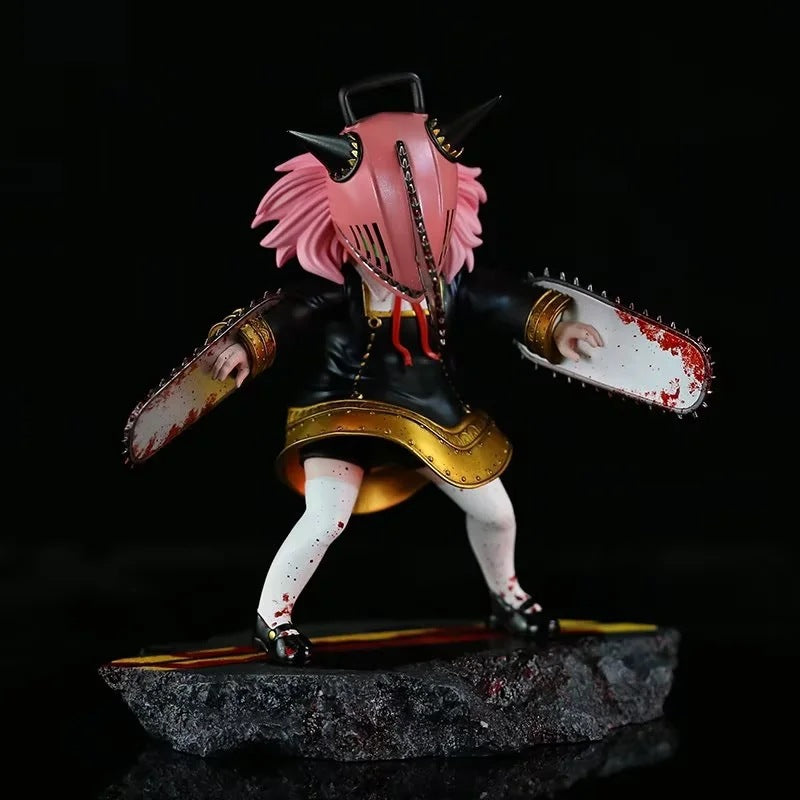 The Chainsaw Man Anya Forger PVC Figure by Spy × Family is a 17.5 cm collectible statue that depicts a character with pink hair, horned helmet, dual blood-spattered chainsaws, and is dressed in black with gold trim and white leggings—a must-have for cosplay enthusiasts.