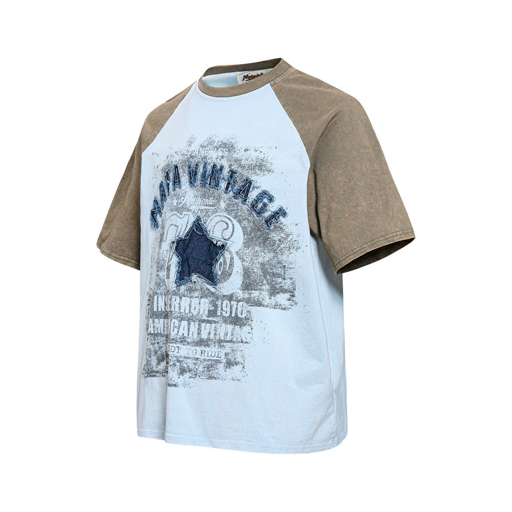 Vintage colorblock raglan T-shirt with light blue body, brown sleeves, and distressed star graphic print