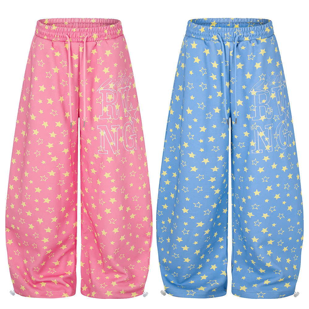 Pink and blue wide leg sweatpants with yellow star print, front view side by side
