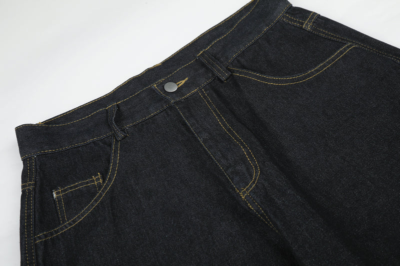 Jean baggy délavé foncé avec bas en fausse fourrure et broderie manuscrite – Coupe ample