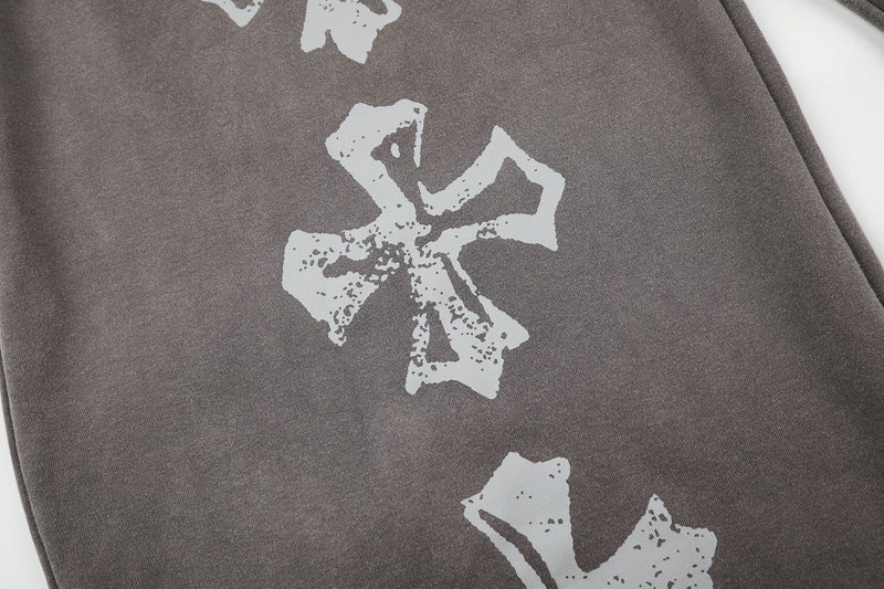 Pantalones de chándal de pierna ancha con cruz estampada y acabado lavado ácido