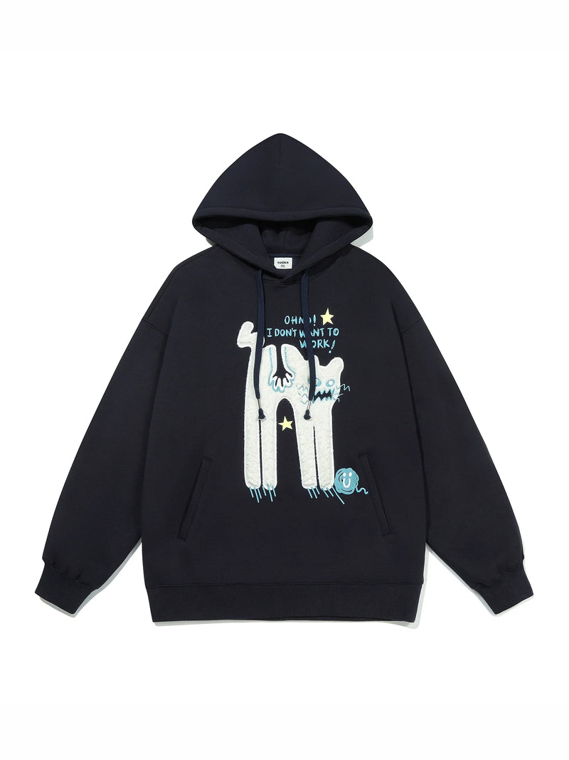 This oversized black hoodie from Seakoff, ideal for casual wear, features a cartoon-like lazy cat design surrounded by stars with the text "Oh No! I Don't Want to Work." It includes a front pocket and drawstrings, making it perfect for laid-back days.