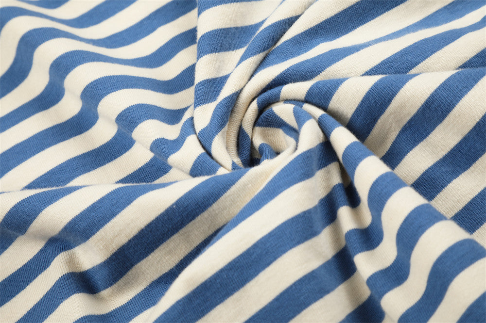 Close-up of blue and cream striped fabric gathered into a swirl
