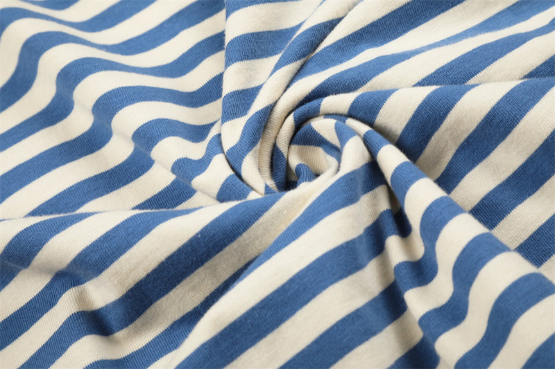 Close-up of blue and cream striped fabric gathered into a swirl